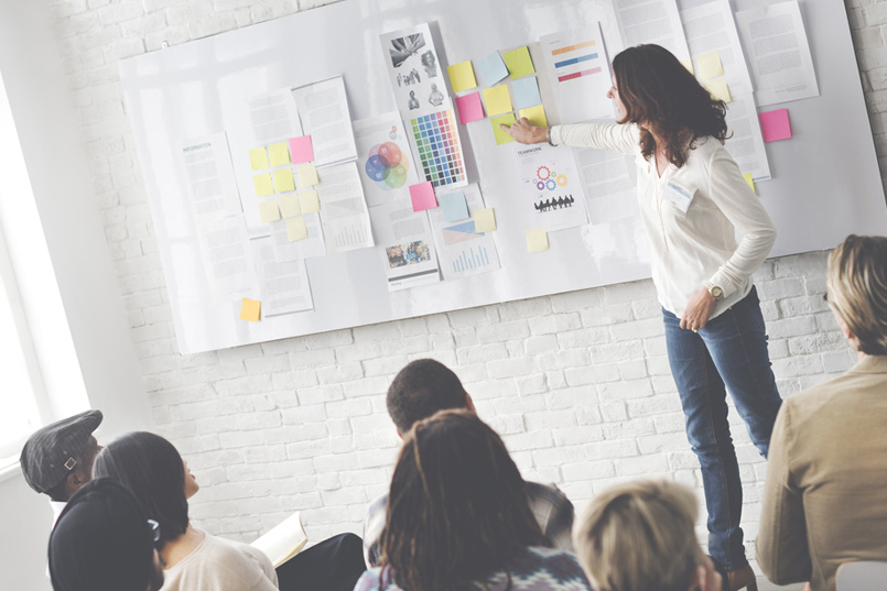 Lady Project Leader Presenting to her team